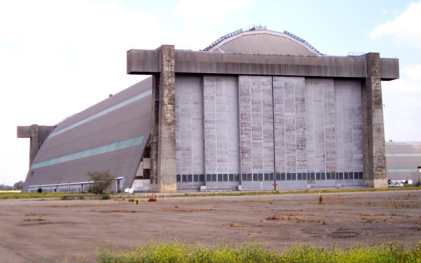 Tustin Blimp Hangar No. 2, a massive wooden aircraft hangar built in 1942, showing the distinctive arched structure of this historic military building